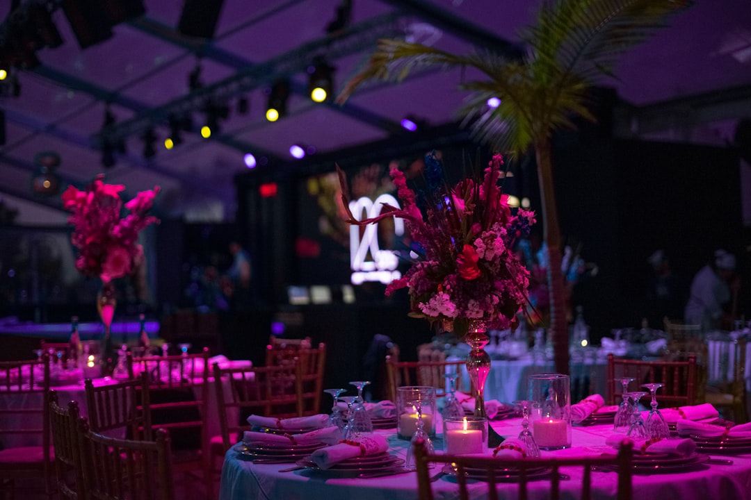 a-table-set-up-for-a-party-with-candles-and-flowers-3pvrufqc-c